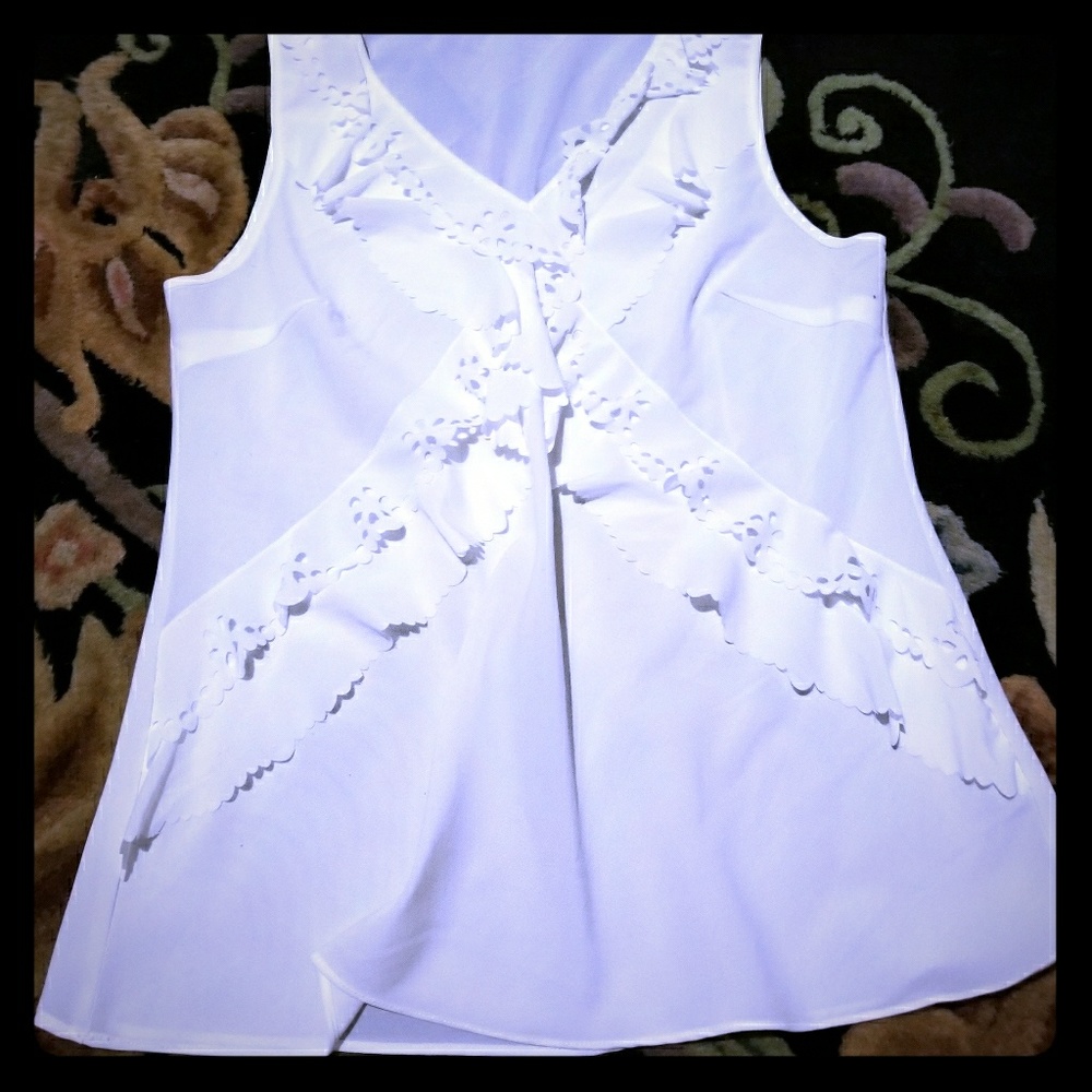 White ruffled sleeveless shirt